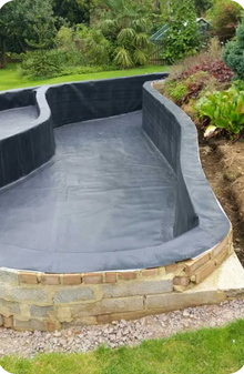 Unique shaped pond with vertical sides was lined by RDL flawlessly